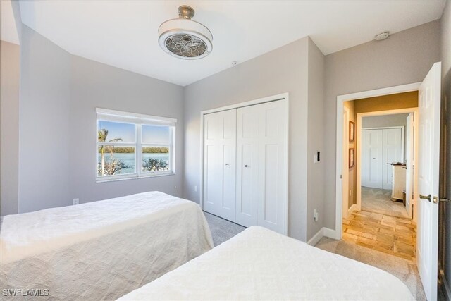 carpeted bedroom with a closet