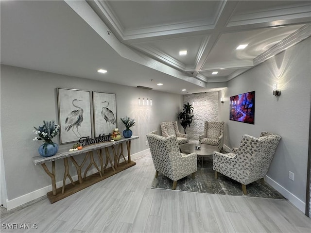 interior space with beamed ceiling, hardwood / wood-style floors, ornamental molding, and coffered ceiling