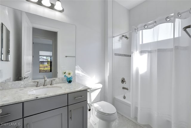 full bathroom featuring shower / bath combo, vanity, and toilet