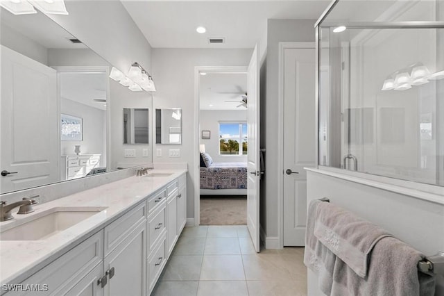 bathroom with tile patterned floors, vanity, ceiling fan, and a shower with door