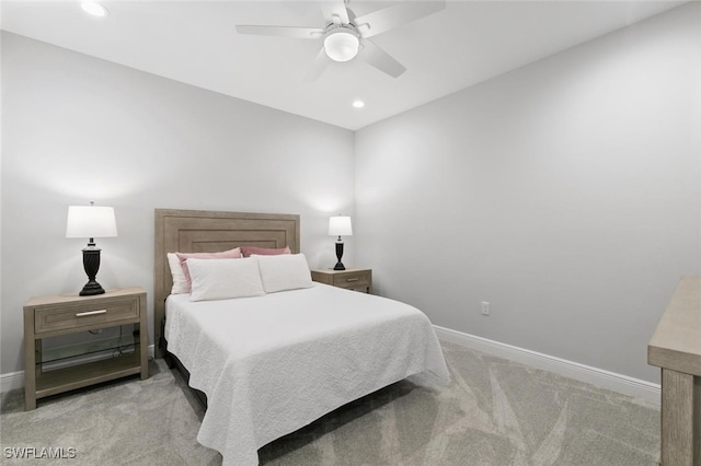 bedroom featuring light carpet and ceiling fan