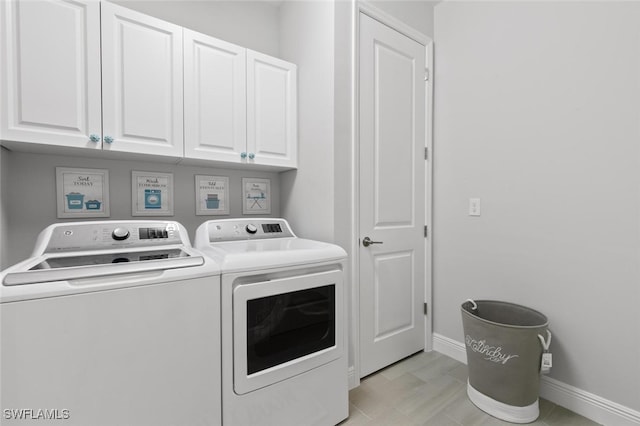 laundry area featuring cabinets and independent washer and dryer