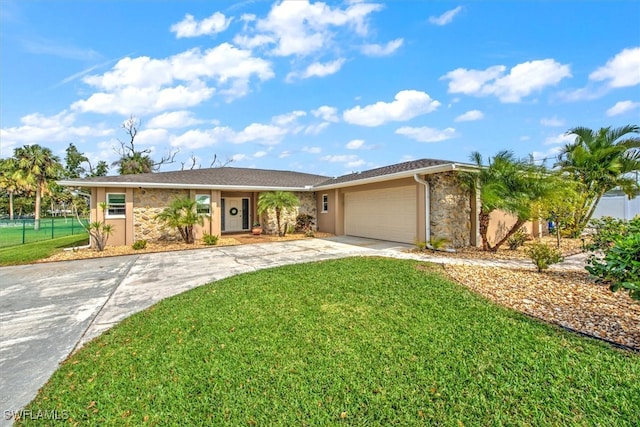 single story home with a garage and a front lawn