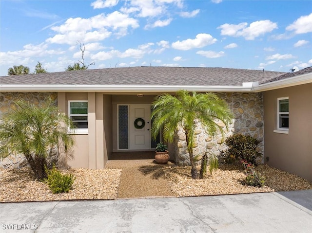 1656 Saint Clair Ave E, North Fort Myers, FL 33903 - property entrance featuring stucco siding and stone siding