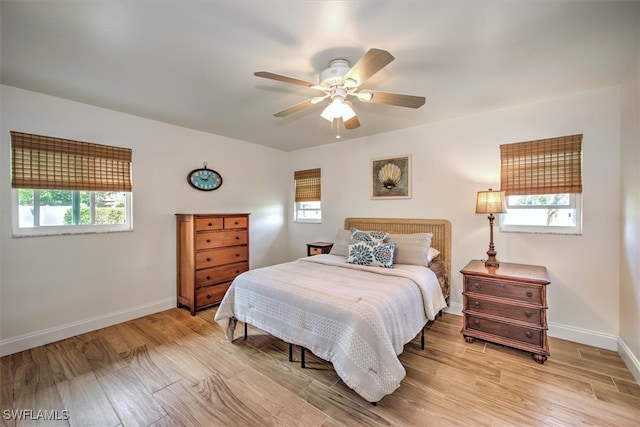 bedroom featuring ceiling fan and light hardwood / wood-style floors