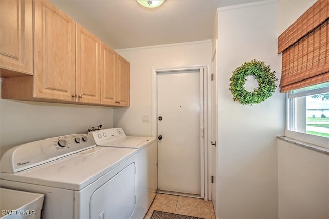 1656 Saint Clair Ave E, North Fort Myers, FL 33903 - laundry area with cabinet space, independent washer and dryer, and light tile patterned floors