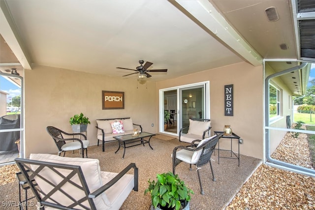 view of patio with outdoor lounge area and ceiling fan