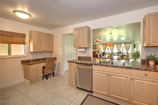 1656 Saint Clair Ave E, North Fort Myers, FL 33903 - kitchen featuring stainless steel dishwasher, light brown cabinets, a sink, baseboards, and an office area