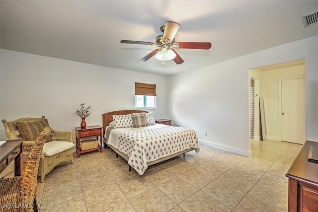 tiled bedroom with ceiling fan