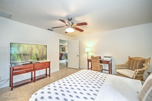 bedroom featuring light tile patterned floors and ceiling fan