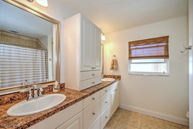 1656 Saint Clair Ave E, North Fort Myers, FL 33903 - bathroom featuring double vanity, tile patterned flooring, baseboards, curtained shower, and toilet