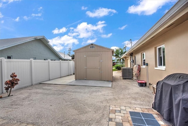 1656 Saint Clair Ave E, North Fort Myers, FL 33903 - view of patio / terrace with central AC unit and a grill