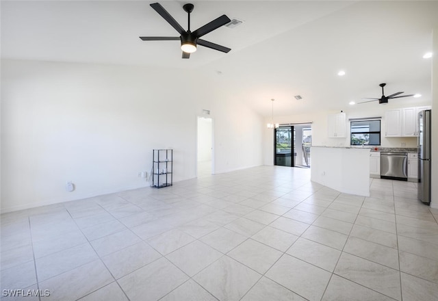 unfurnished living room with light tile patterned floors, ceiling fan with notable chandelier, and lofted ceiling