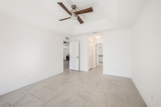 spare room with light tile patterned floors and ceiling fan