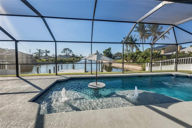 view of pool featuring pool water feature, a water view, and a lanai