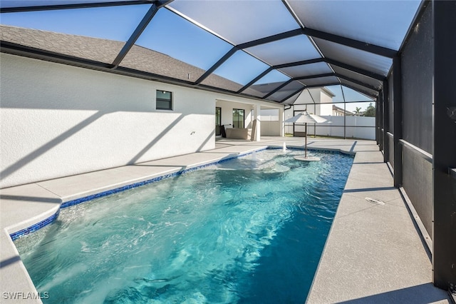 view of pool featuring a patio area and glass enclosure