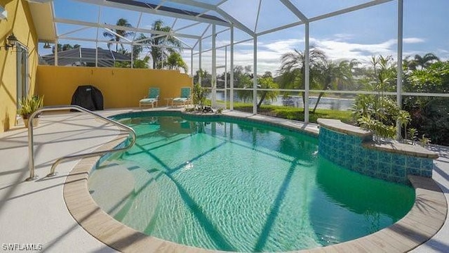 view of pool featuring a lanai and a patio