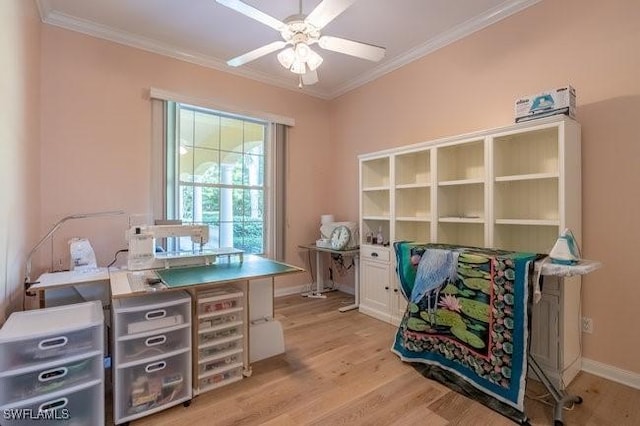 office with crown molding, ceiling fan, and light wood-type flooring