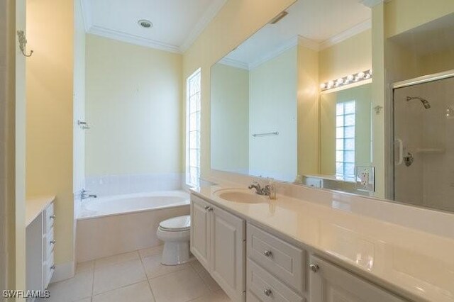 full bathroom featuring vanity, plus walk in shower, tile patterned floors, crown molding, and toilet