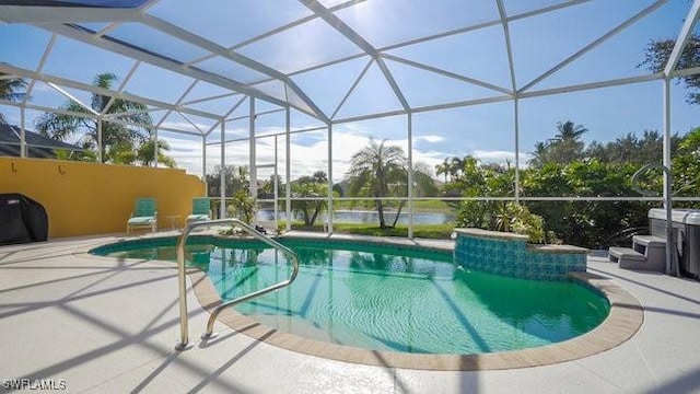 view of swimming pool featuring a patio, area for grilling, and a lanai