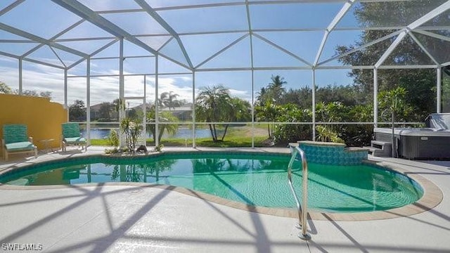 view of pool featuring a lanai, a patio, and a hot tub