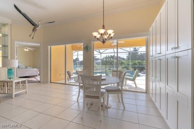 dining space with light tile patterned floors and ceiling fan with notable chandelier