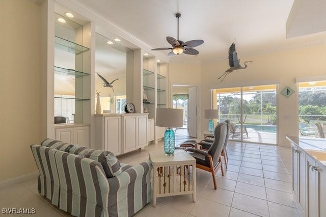 tiled living room with ceiling fan