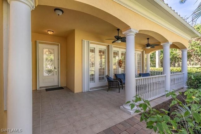 view of patio featuring ceiling fan and a porch