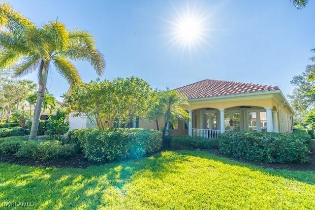 mediterranean / spanish-style house featuring a front lawn