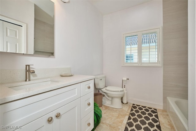 bathroom featuring tile patterned floors, vanity, and toilet