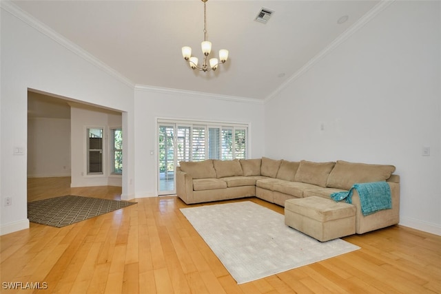 unfurnished living room featuring hardwood / wood-style floors, an inviting chandelier, and ornamental molding