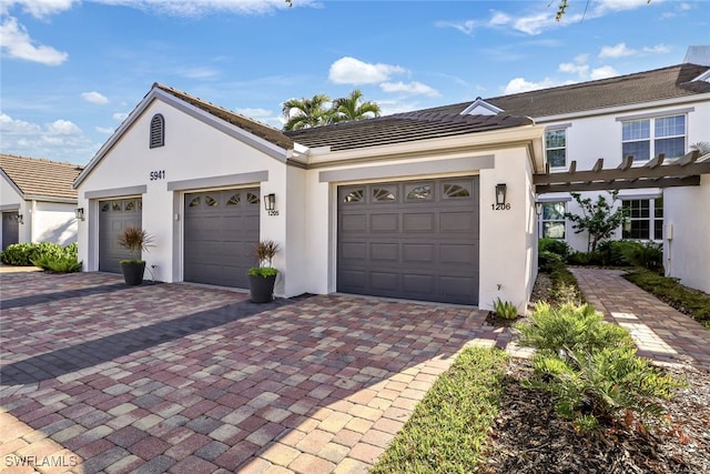 view of front of property with a garage