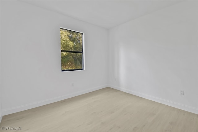 spare room featuring light hardwood / wood-style flooring