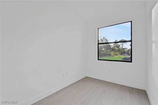 spare room with light hardwood / wood-style floors