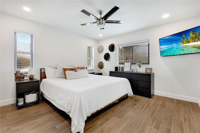 bedroom with wood-type flooring and ceiling fan