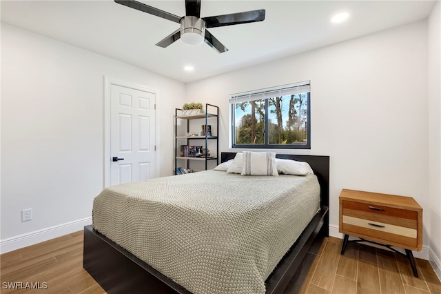 bedroom featuring hardwood / wood-style flooring and ceiling fan