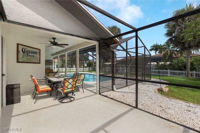 view of swimming pool featuring a lanai, a patio area, and ceiling fan