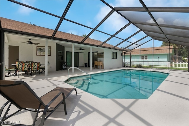 view of pool featuring a patio area, ceiling fan, and a lanai