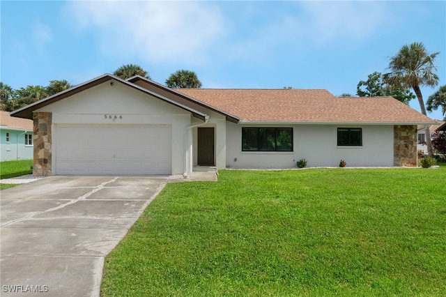 ranch-style home with a front yard and a garage