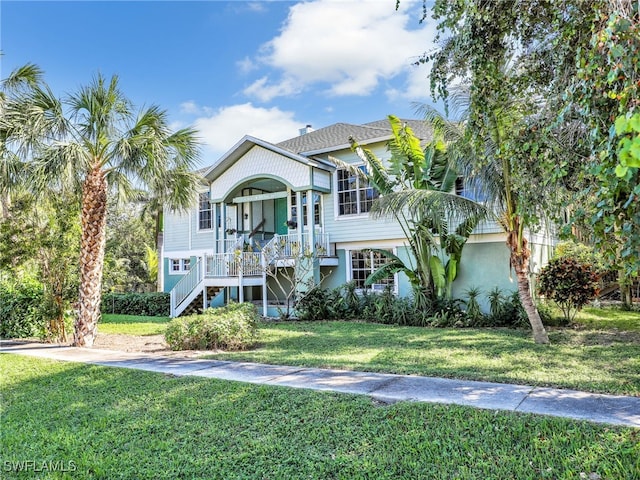 view of front of home featuring a front lawn and a porch