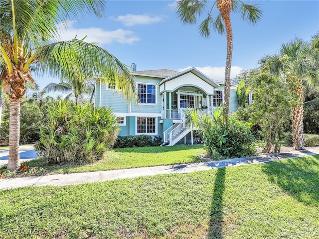 view of front facade featuring a porch and a front yard