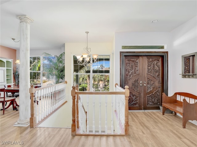 foyer featuring a notable chandelier and light wood-type flooring