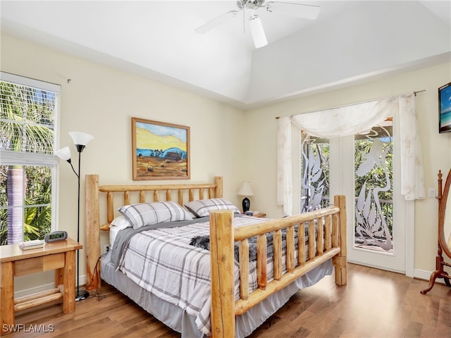 bedroom featuring hardwood / wood-style flooring, ceiling fan, and vaulted ceiling