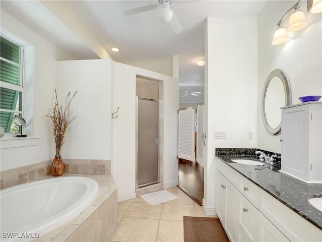 bathroom featuring tile patterned floors, vanity, ceiling fan, and plus walk in shower