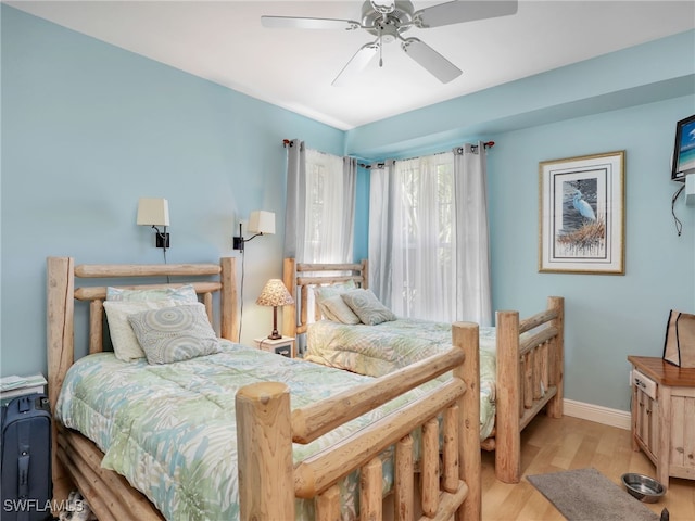 bedroom featuring light hardwood / wood-style flooring and ceiling fan