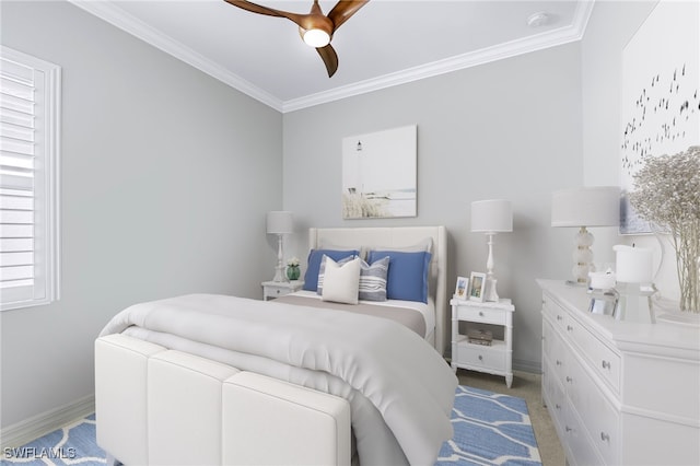 bedroom featuring ceiling fan and ornamental molding