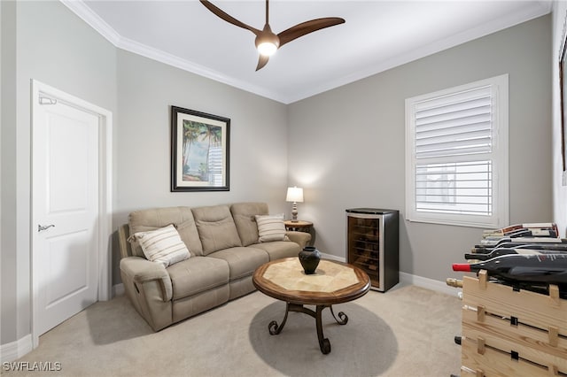 carpeted living room with beverage cooler, ornamental molding, and ceiling fan