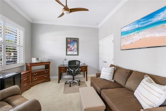 carpeted home office featuring ceiling fan and ornamental molding