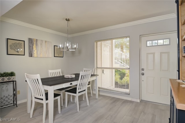 dining space with plenty of natural light and ornamental molding