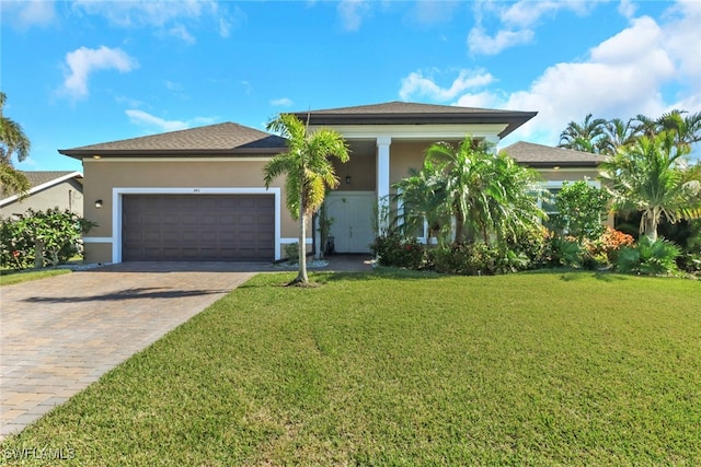 view of front facade with a front lawn and a garage